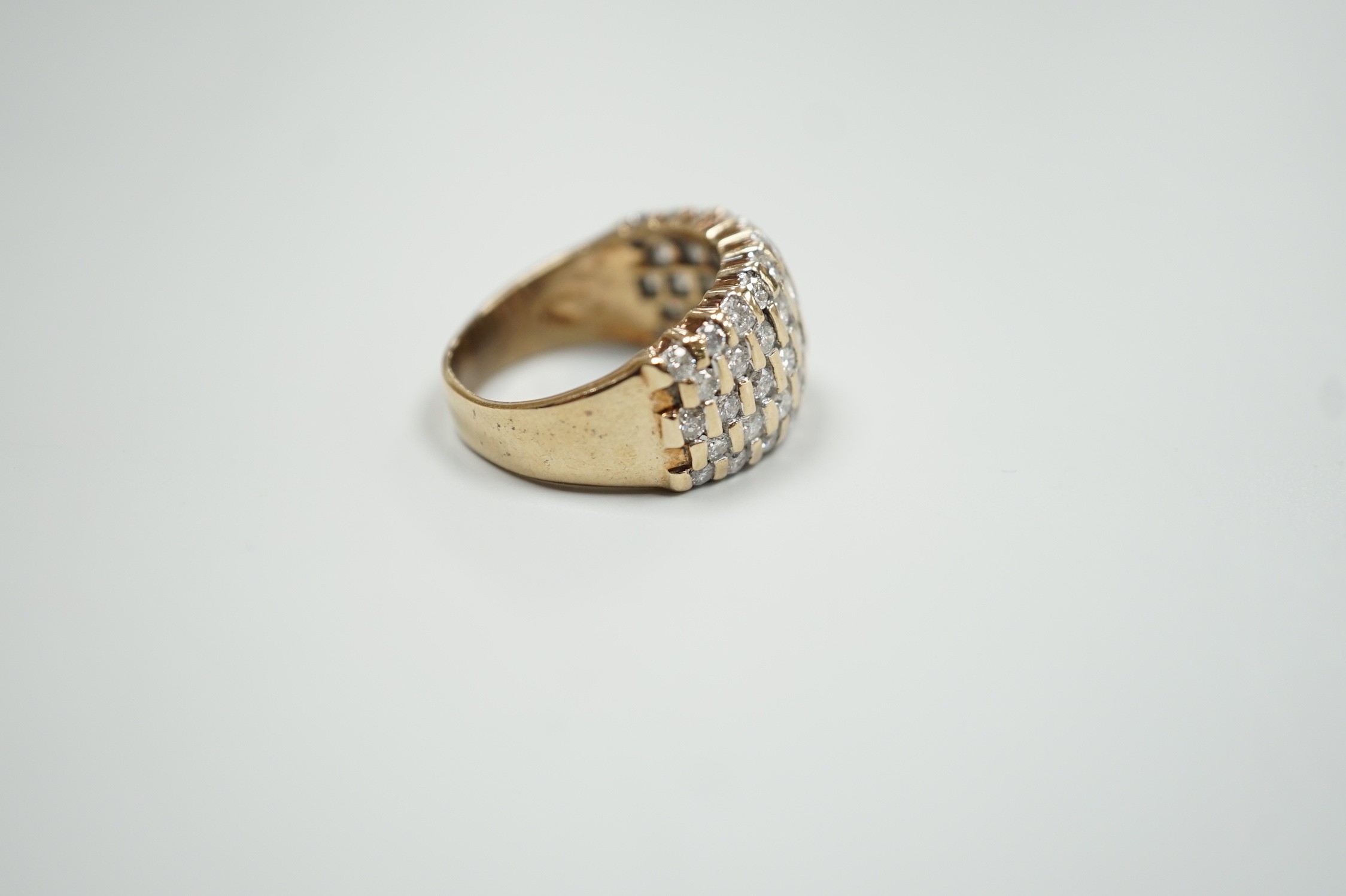 A modern yellow metal and pave set five row diamond dress ring, size R, gross weight 9.2 grams.